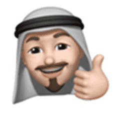 A participant in a keffiyeh, giving a thumbs up